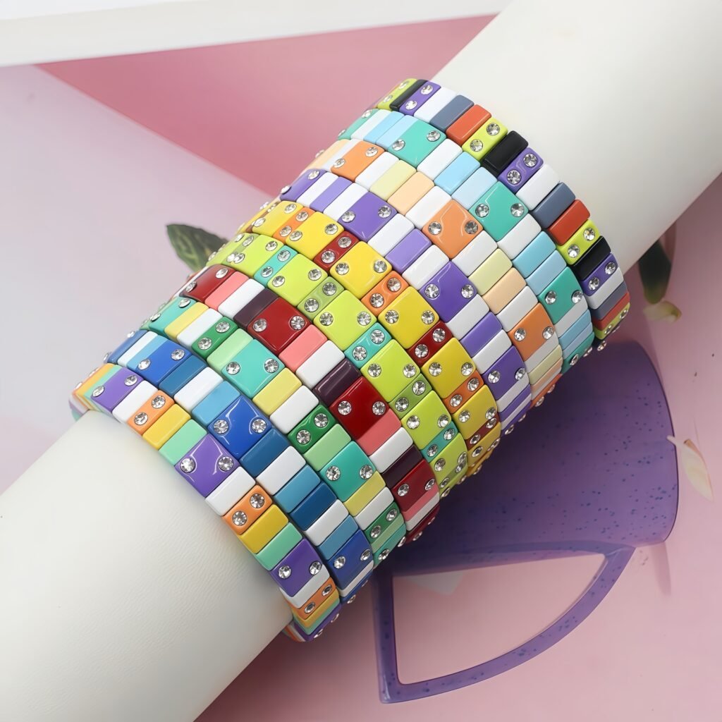 Enamel Tila Tile Stretchy Bracelet Wholesale Our Enamel Tila Tile Stretchy Bracelet is crafted with colorful enamel tile beads and a comfortable elastic cord, offering a stylish and durable colorblock stretch bracelet for everyday wear, stacking, summer fashion, and boutique collections. The vibrant enamel finish, carefully selected beads, and flexible stretch design create a fashionable bracelet that combines quality craftsmanship, attractive colors, and comfortable wear.​ Yaochan Jewelry is a professional enamel jewelry manufacturer and wholesale supplier in China, specializing in handmade enamel bracelets, enamel tile bracelets, enamel stretch bracelets, colorful tile bead jewelry, enamel rings, and custom fashion jewelry.​ Our Yiwu jewelry factory provides OEM & ODM manufacturing, private label services, custom designs, bulk orders, and factory-direct wholesale pricing for jewelry brands, wholesalers, boutiques, distributors, and online retailers.​ We offer rainbow enamel tile bracelets, colorful enamel stretch bracelets, square tile bead bracelets, Tila tile bracelets, colorblock bracelets, and statement jewelry for modern fashion markets. We supply wholesale jewelry to customers in the USA, Europe, Amazon, Etsy, and worldwide markets.​ Contact Yaochan Jewelry for wholesale enamel bracelets, custom enamel jewelry, bulk jewelry manufacturing, OEM & ODM services, and factory-direct China jewelry supply.